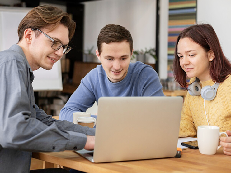 Dropshipping Team Working on Laptop